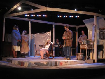 Performers on stage in a scene from Trifles, the Fall 2021 production at Utica College.