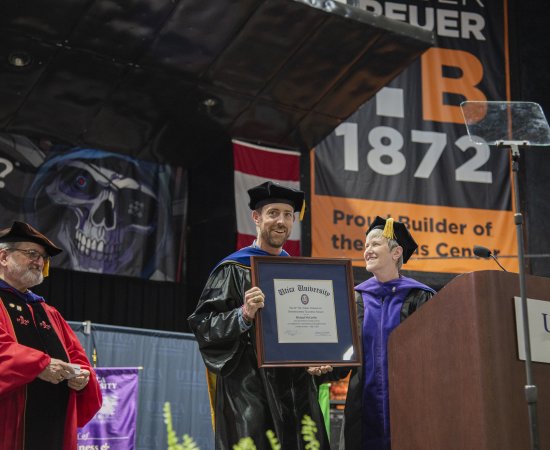 Dr Michael McCarthy receives the 2025 Crisafulli Award at the Undergraduate Commencement Ceremony.