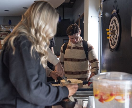 Students make their own sundaes in Pioneer Cafe.