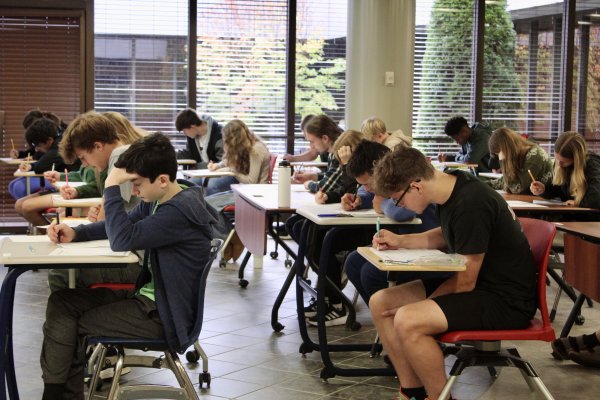 Students at desks taking part in the AMC10/12 Mathematics Competition.