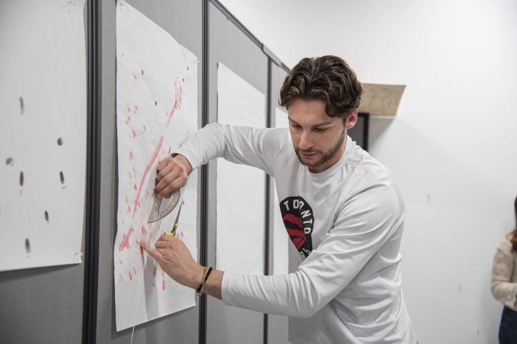 Eric Vitale works in the crime scene lab.